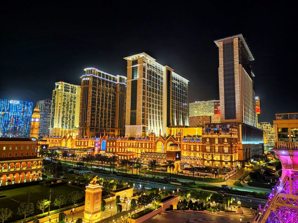 Macau, China - April 10, 2024: Vibrant night lights illuminate Macau Island's famous casino skyline over bustling streets
